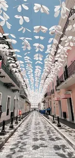 Colorful street with overhead decorations.