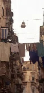 Urban street scene with hanging laundry and city atmosphere.