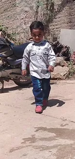 Child walking in urban setting with fashionable style.