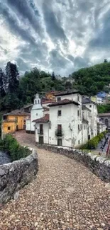 Scenic village with cobblestone path and lush greenery under cloudy skies.