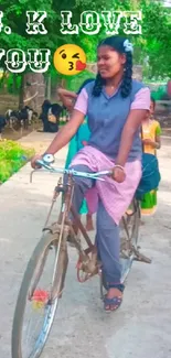 Woman cycling on village path surrounded by nature.