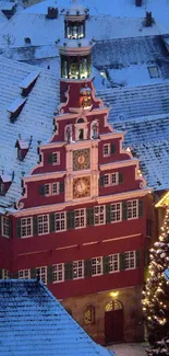 Snow-covered village with festive lights and charming architecture.