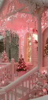 Snowy porch with pink Christmas lights and wreath.