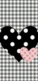 Checkered wallpaper with black and pink polka dotted hearts.