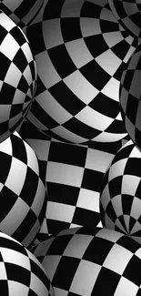 Black and white checkered spheres wallpaper, optical illusion design.