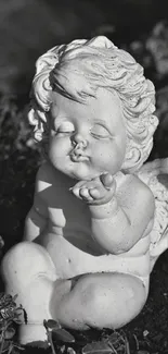 A serene angel sculpture in black and white.