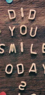 Colorful motivational wallpaper with wooden background and message: "Did you smile today?"