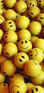 Vibrant yellow wallpaper with happy smiley faces for mobile phones.