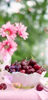 Bowl of cherries with pink flowers and heart accents in soft focus.