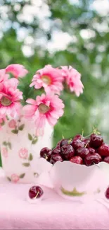 Wallpaper with pink flowers and cherries in a serene garden setting.