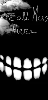 Cheshire Cat grin with 'We're all mad here' text on black background.