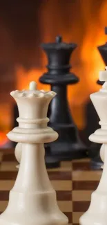 Chess pieces with a fiery background on a chessboard wallpaper.