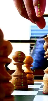 Close-up of a hand moving wooden chess pieces with a digital background.