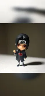 Chibi ninja figure on dark background, perfect for anime-themed wallpaper.