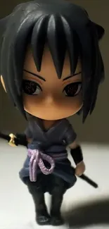 Chibi samurai anime figure with dark hair and sword, perfect for mobile wallpaper.