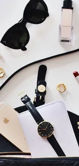 Elegant flatlay with chic accessories and smartphone.