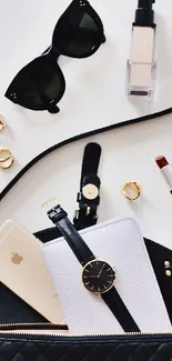 Flatlay with fashion accessories, phone, and handbag in chic style.