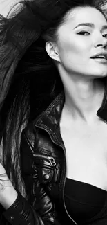 Chic woman in black leather jacket, monochrome style.