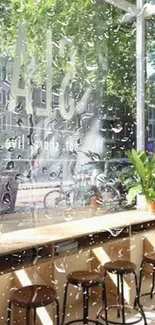 Stylish cafe interior with urban street view and green plants.