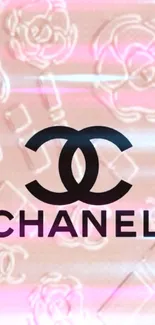 Soft pink Chanel logo mobile wallpaper with floral accents.