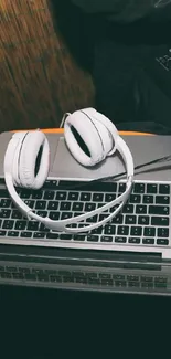 DJ setup with laptop, mixer, and headphones in a modern, stylish setting.