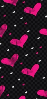 Mobile wallpaper with pink hearts on black checkered background.