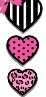 Three chic hearts with different patterns and pink hues on a stylish wallpaper.