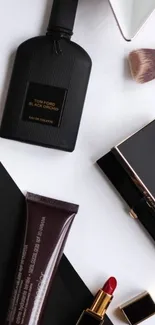 Flat lay of luxury makeup products including Tom Ford and Chanel.