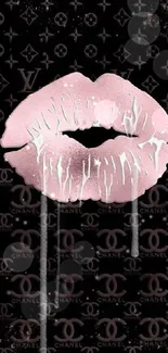 Chic pink lips on black fashion-themed background.