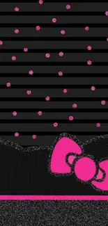 Black and pink wallpaper with polka dots and bow design.