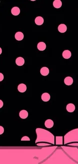 Chic wallpaper with pink polka dots and elegant bow on black background.