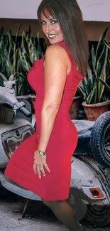 Woman in a red dress with vintage scooter backdrop.