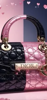 Two-tone pink and black handbag with heart motifs.