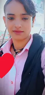 Woman in pink shirt with red heart on mobile wallpaper