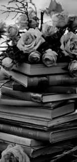 Black and white wallpaper of books and roses.