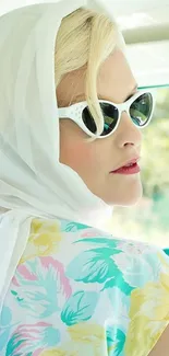 Chic woman in vintage floral dress and sunglasses, exuding retro summer style.