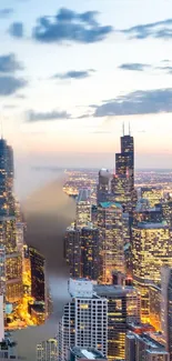 Chicago skyline at dusk with illuminated city lights and blue evening sky.