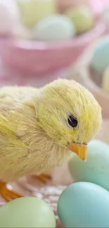 Fluffy chick amidst pastel colored eggs wallpaper.