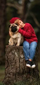 Child in red sweater embracing dog in forest setting.