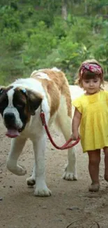 Child in yellow dress walking a large dog on a green path.