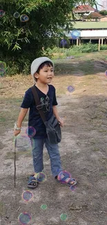 Child walking on nature path with bubbles floating around.