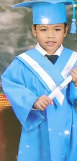 Young graduate in blue gown holding a diploma.