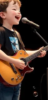 A joyful child singing and playing guitar with a microphone.