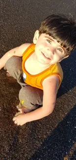 Joyful child playing on a sandy beach at sunset, radiating happiness.