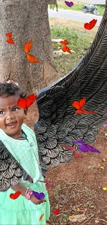 A child wearing black angel wings stands smiling by a tree.