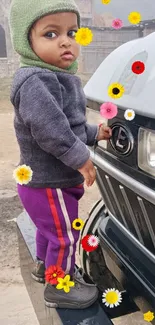 Child in colorful attire with flowers on a sunny day.