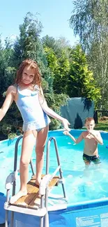 Children having fun in a pool on a sunny summer day.