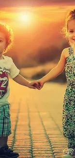 Two children hold hands during a sunset stroll on a cobblestone path.