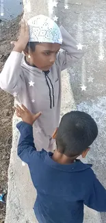 Two children play with star effects near water.