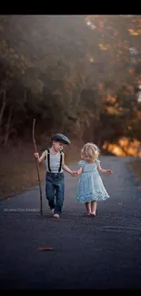 Children walking along a tree-lined path in autumn.